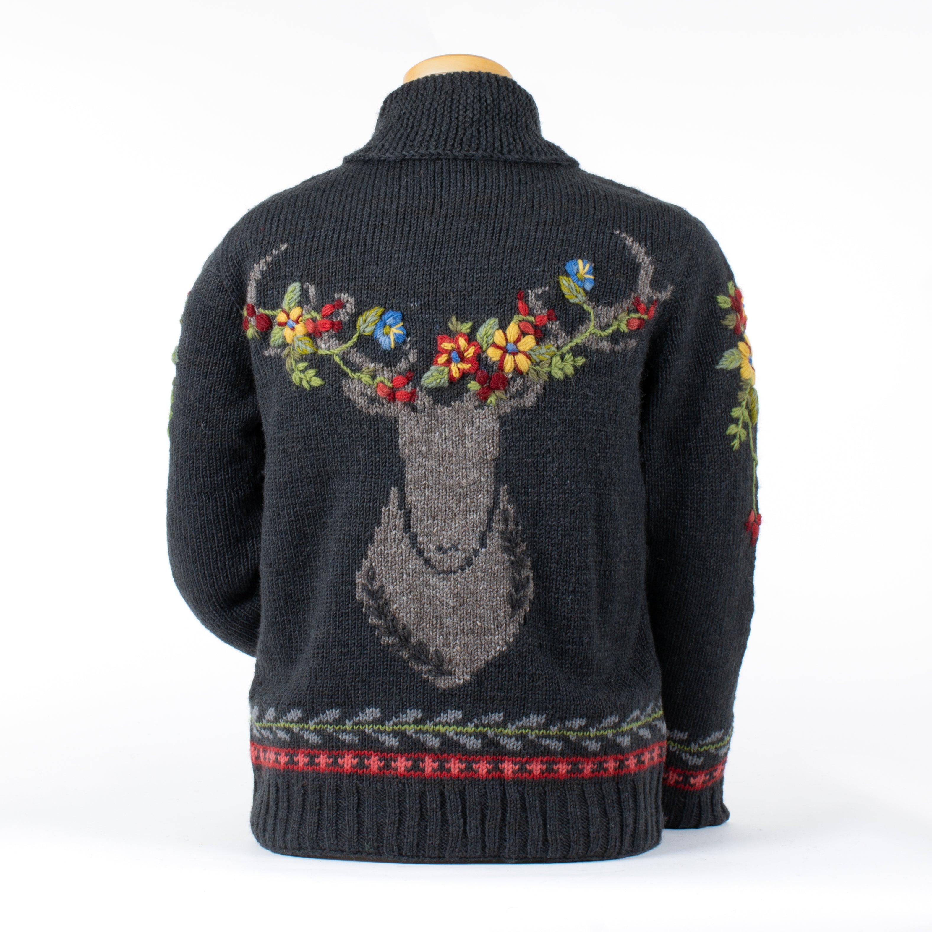 Black sweater with deer design and floral antlers on a white background