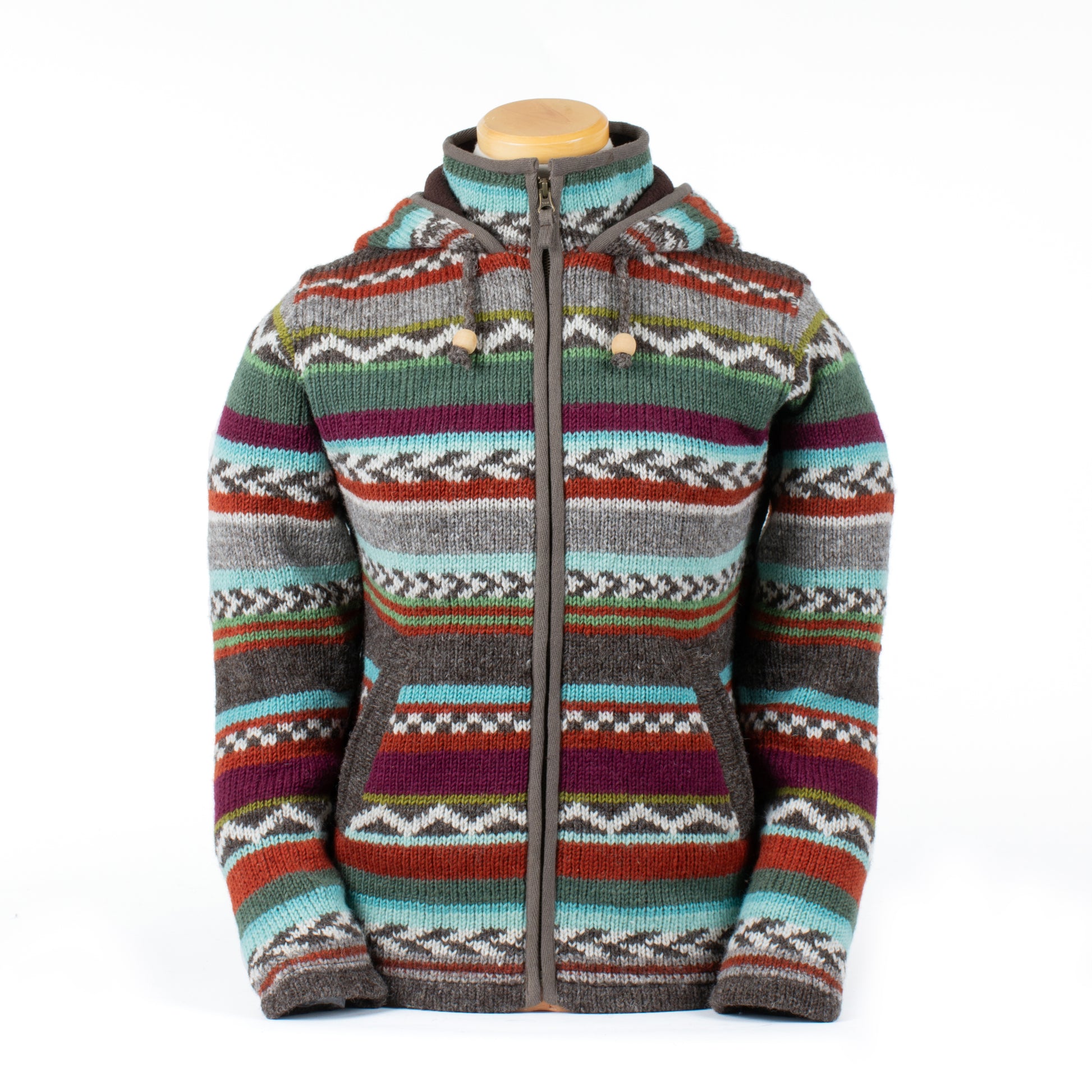 Hand-knit wool zip-up hoodie with colorful Nordic-inspired stripes, fleece lining, front pockets, and hood with toggle drawstrings. Rustic outdoor style.