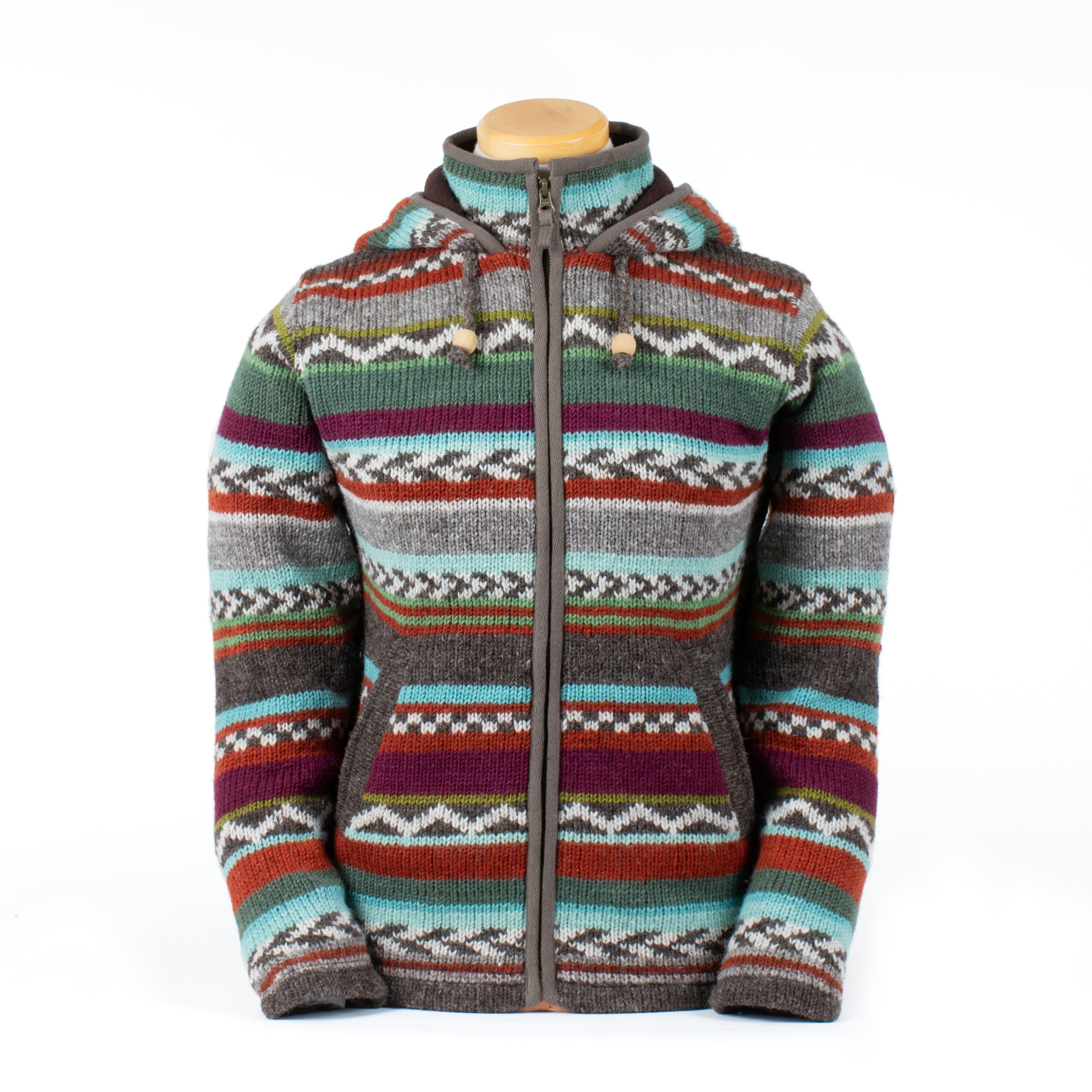 Hand-knit wool zip-up hoodie with colorful Nordic-inspired stripes, fleece lining, front pockets, and hood with toggle drawstrings. Rustic outdoor style.