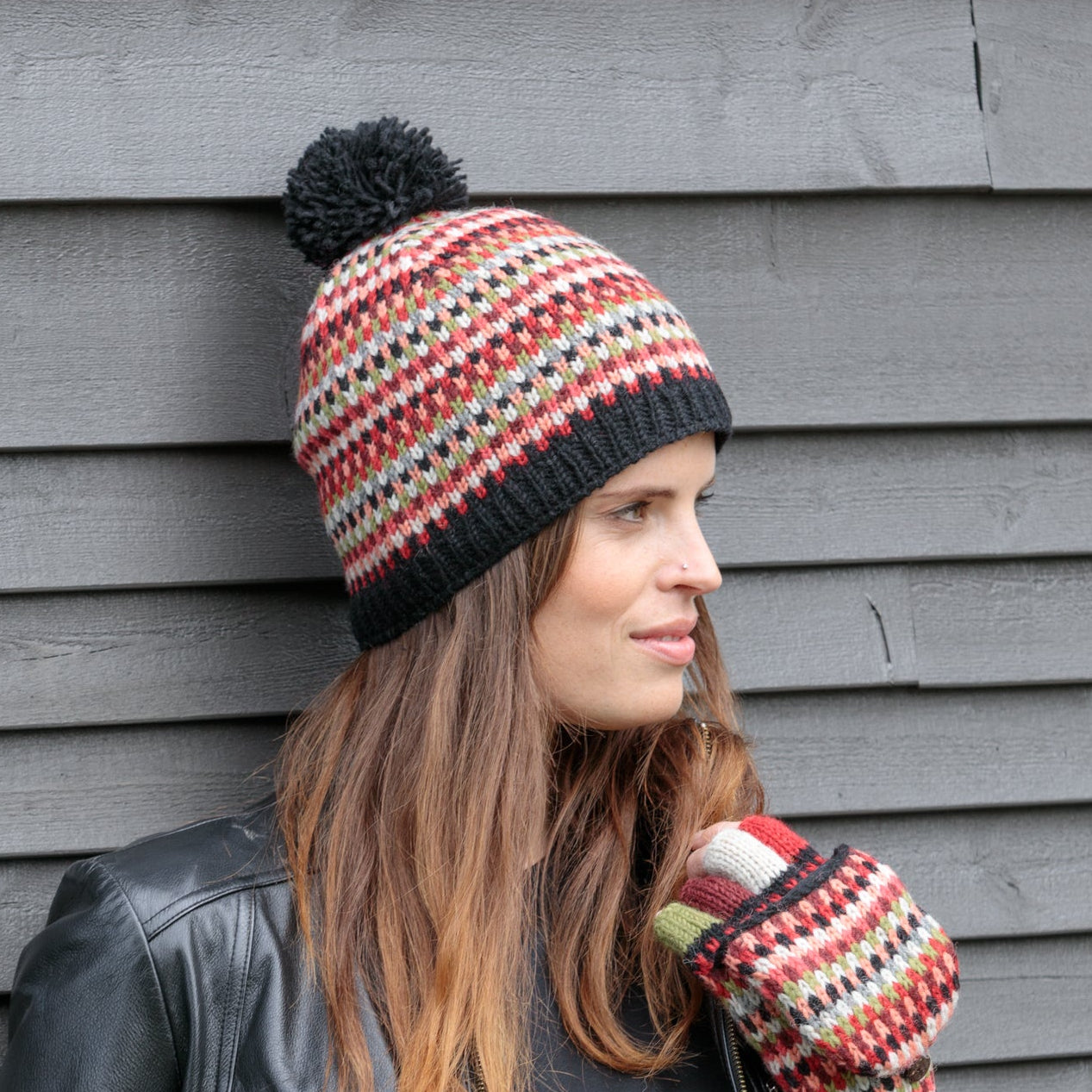 woman wearing colorful knit beanie and mittens from Lost Horizons